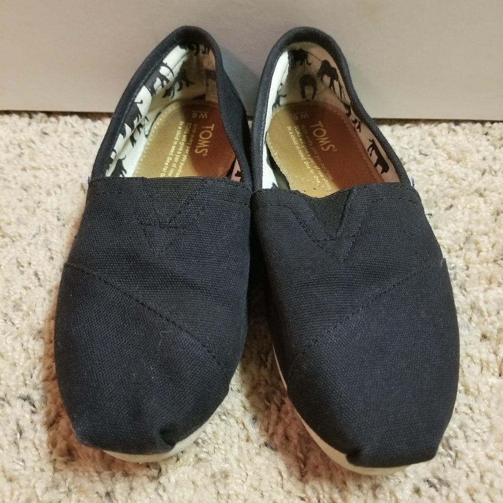 Toms black slip-on shoes